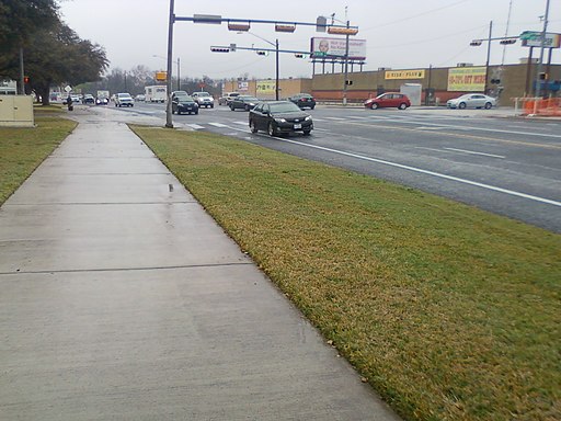 Sidewalk and road after rain